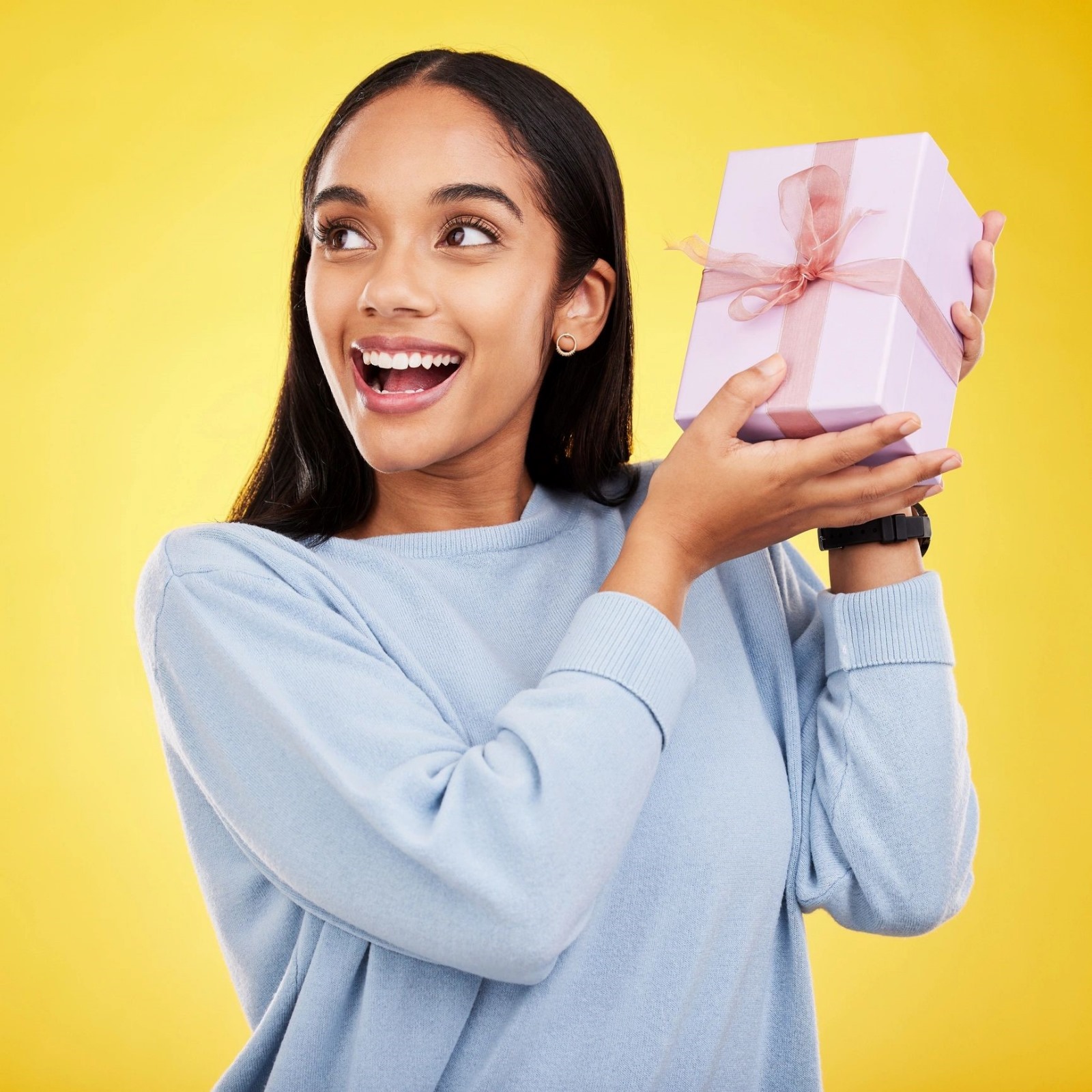 Woman holding a pink gift box